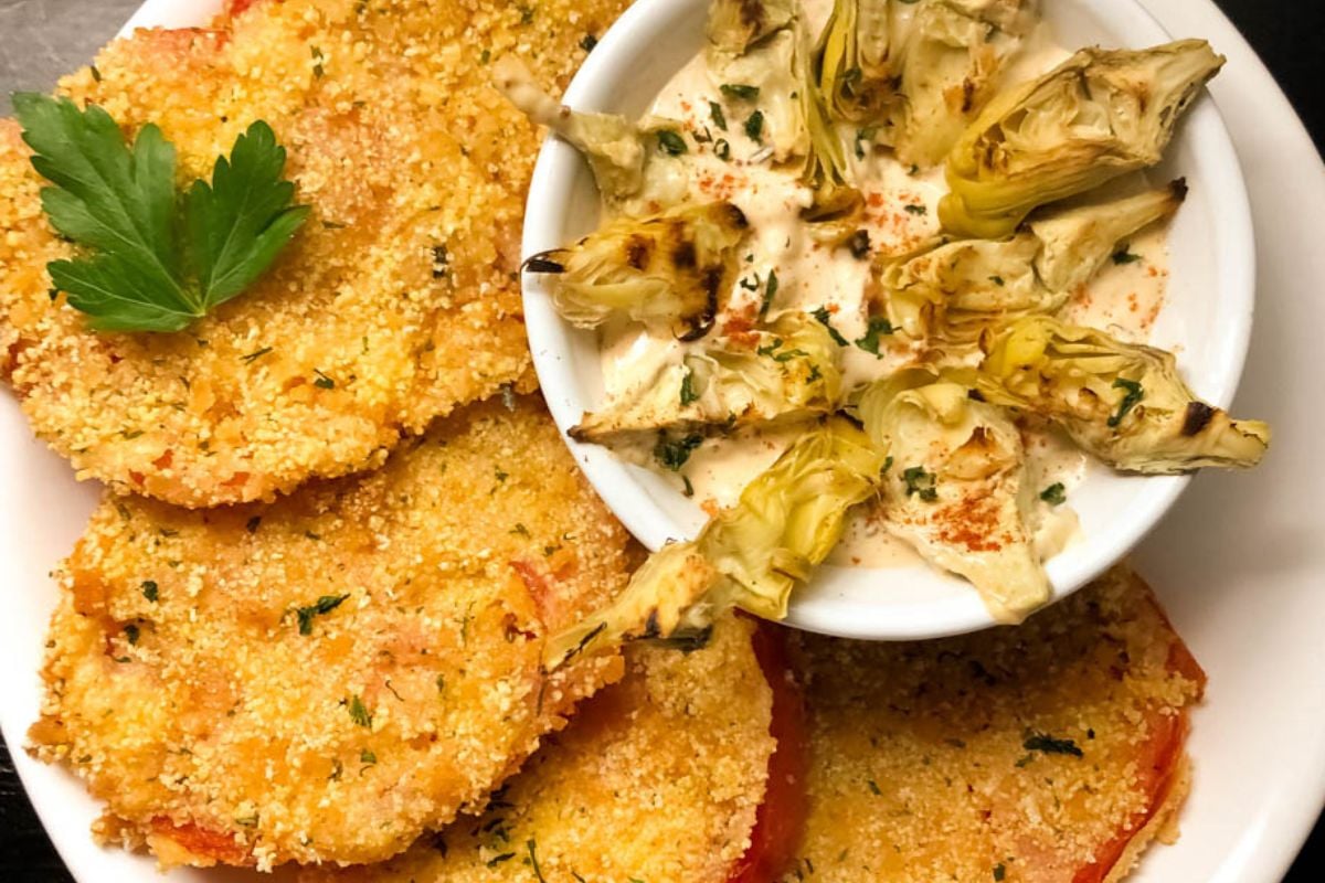 Fried red tomatoes with artichoke remoulade sauce.