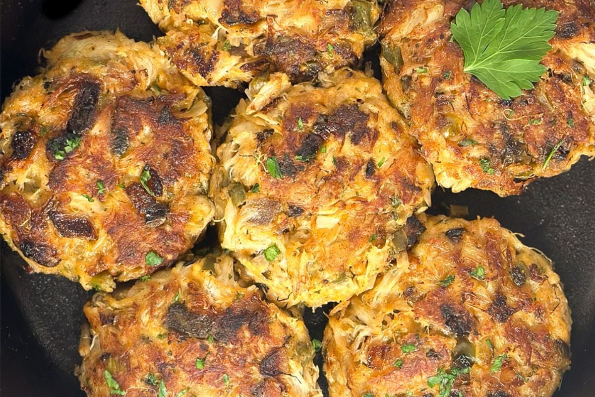 Cajun crab cakes in a skillet. 