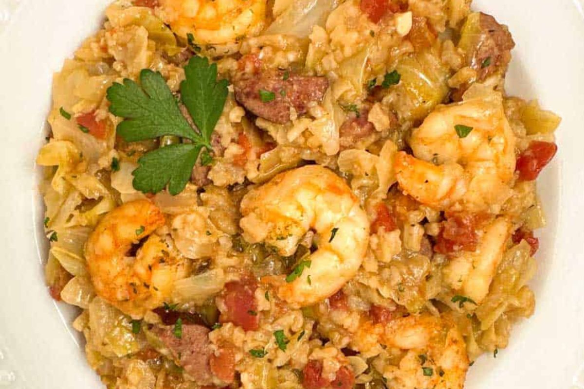 Cajun cabbage jambalaya in a round white bowl.