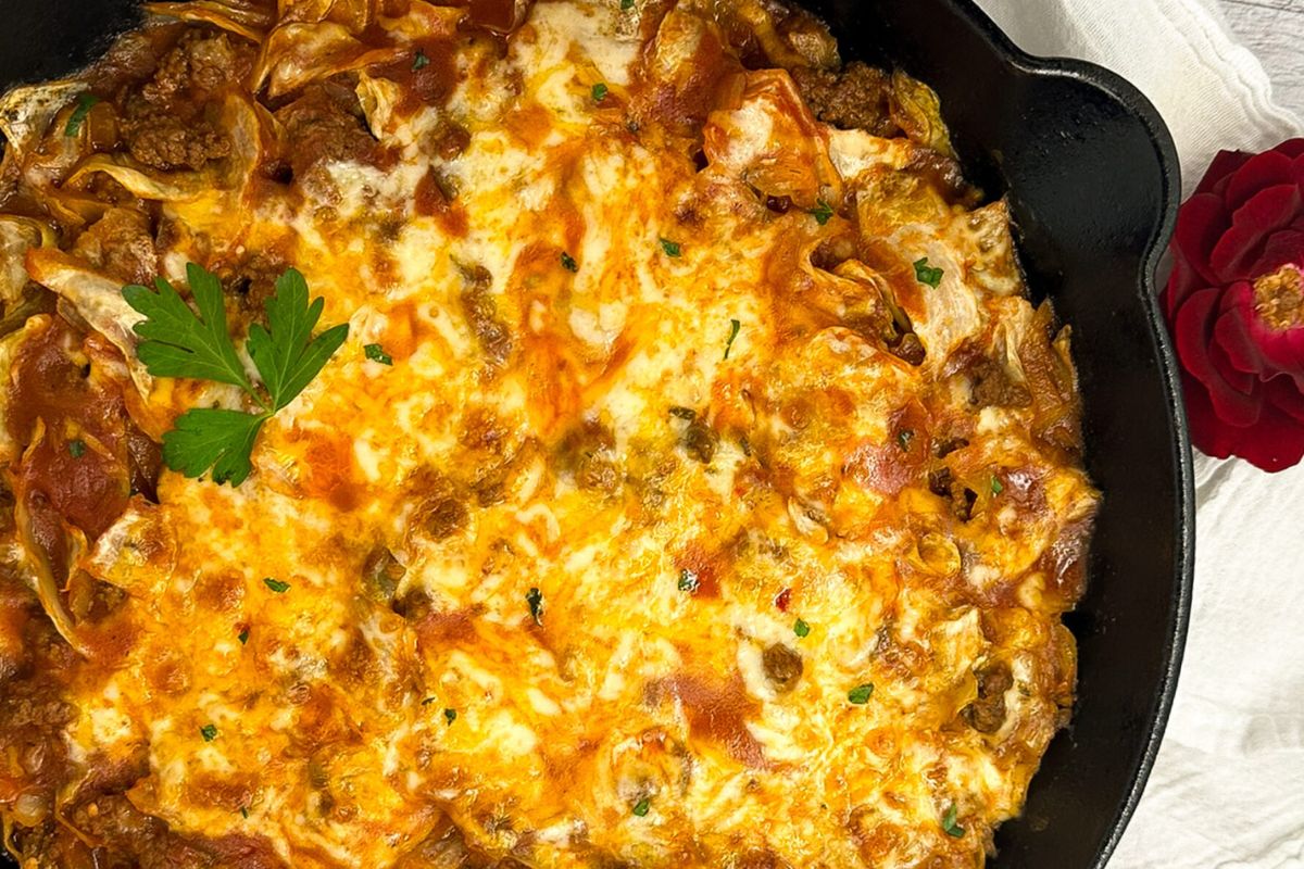 Cajun cabbage casserole in a cast iron skillet.