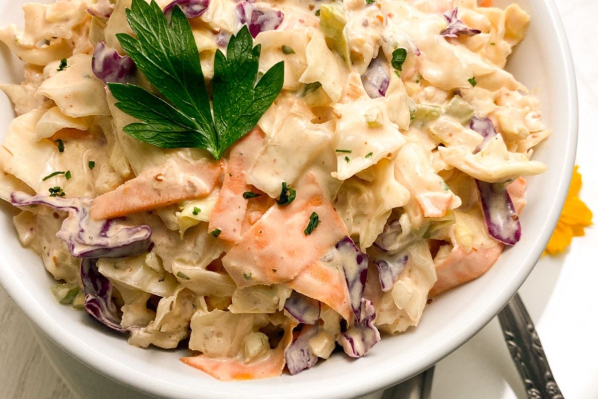 Remoulade slaw in a small white bowl. 