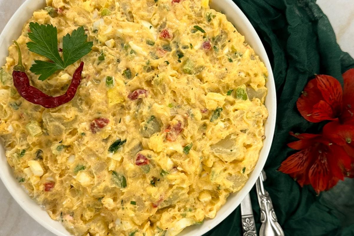 Cajun potato salad in a white bowl.
