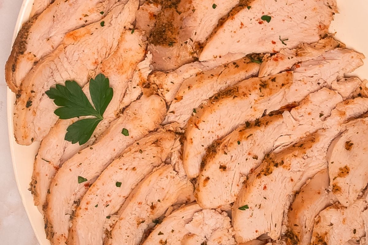 Cajun turkey breast slices on a serving plate.