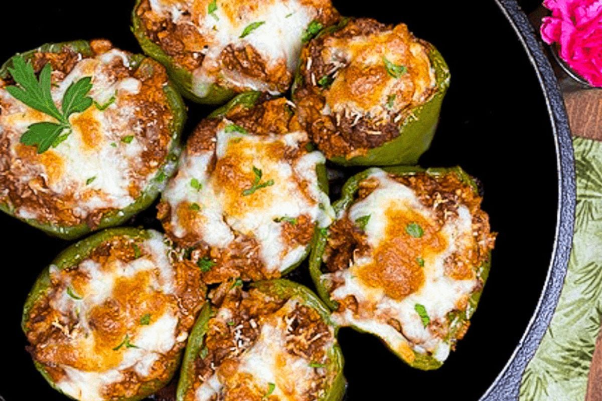 Cajun stuffed bell peppers in a cast iron skillet. 