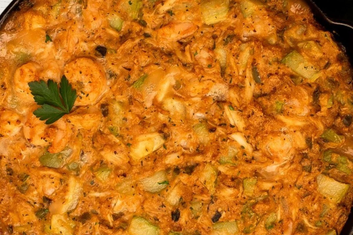 One of the famous Cajun Christimas recipes, mirliton dressing, in a cast iron skillet. 