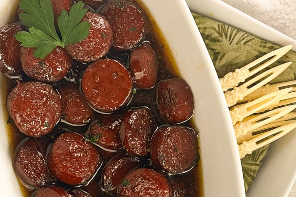 Beef Sausage Bites in an oval white serving dish.