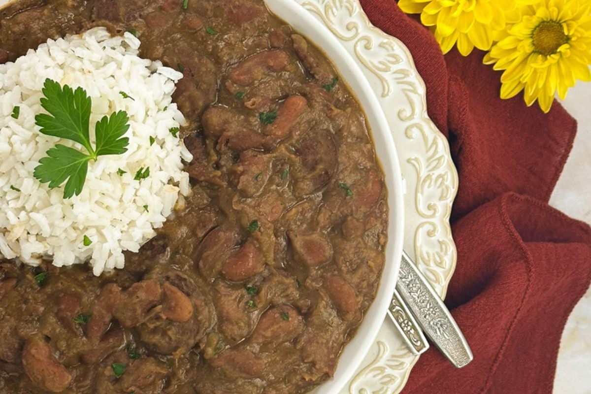 Red beans and rice on a round white plate. 