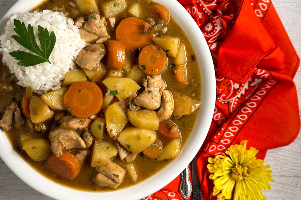 Cajun Chicken Stew in a round white bowl. 