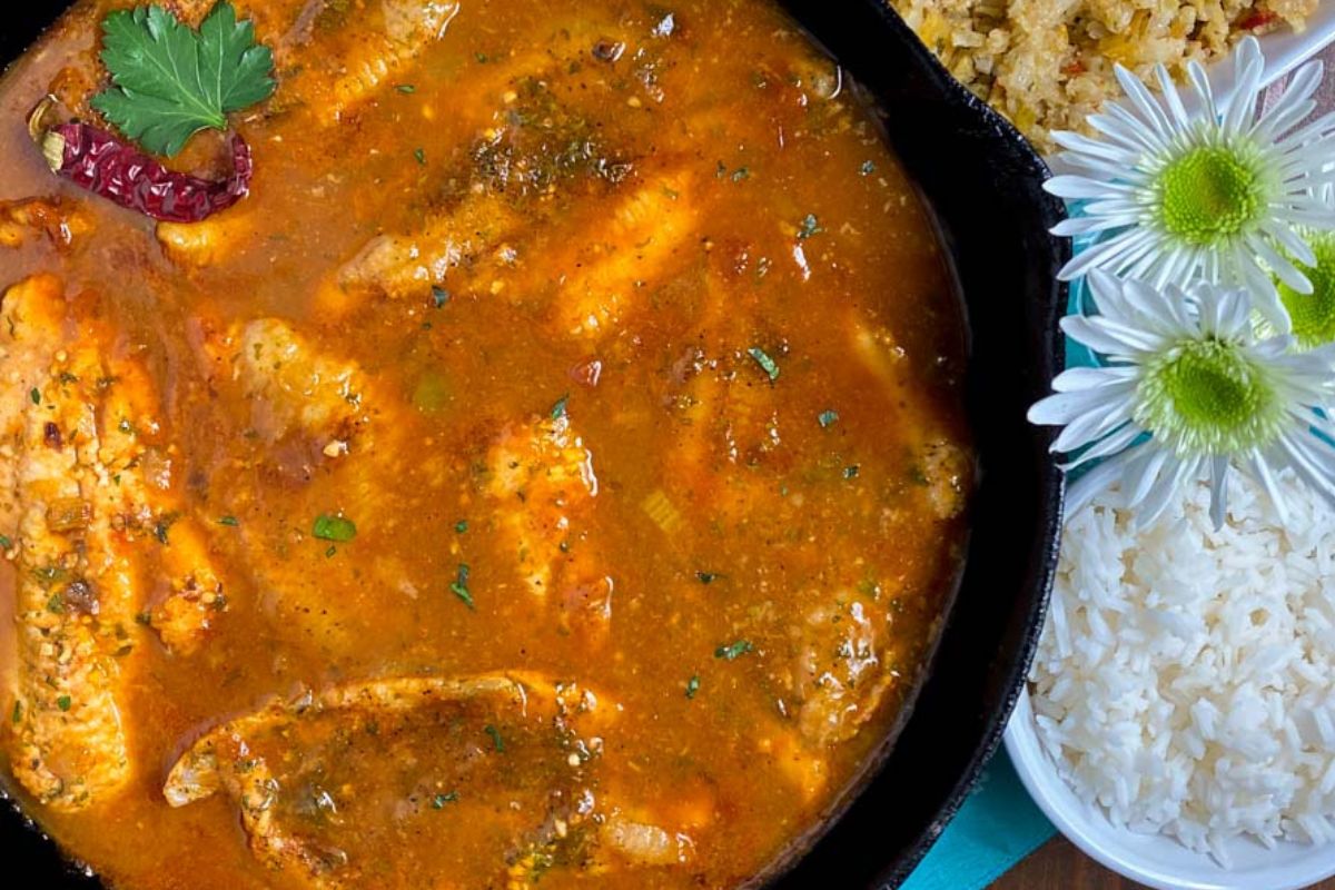 Catfish Courtbouillon in a black skillet.