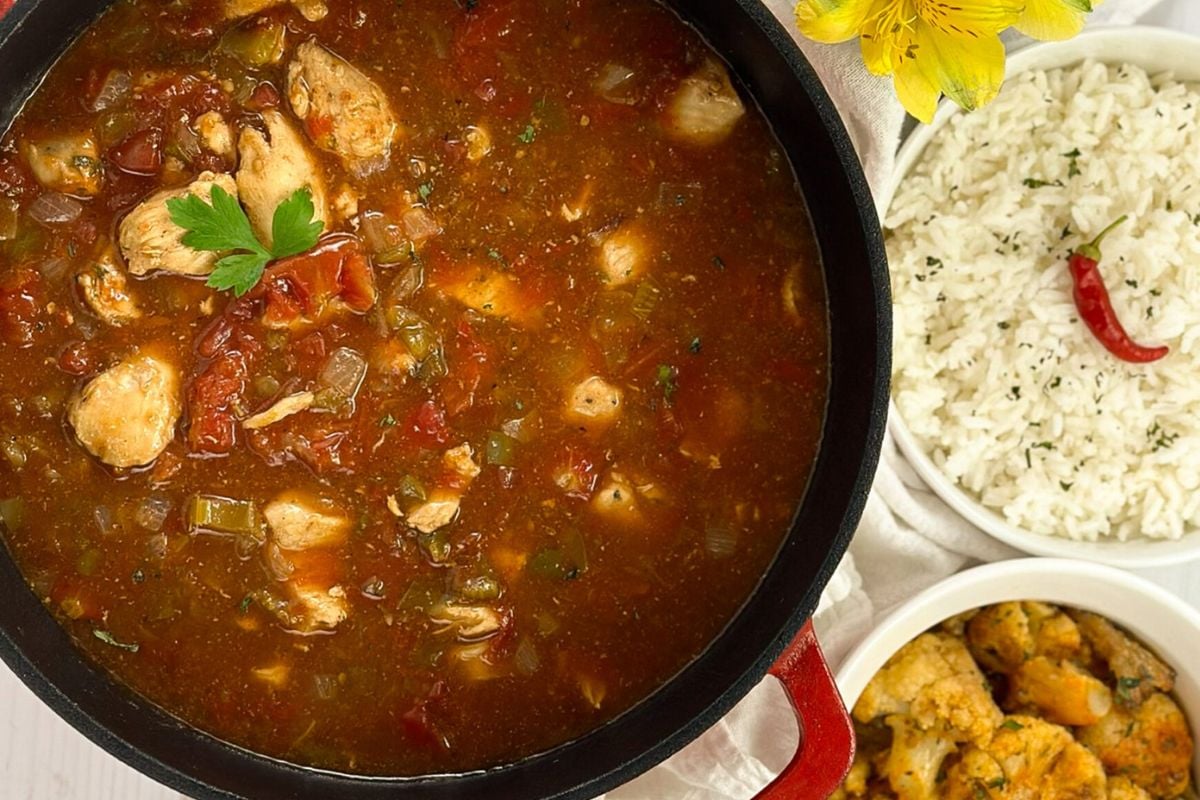 Chicken sauce piquant in an enameled cast iron Dutch oven.