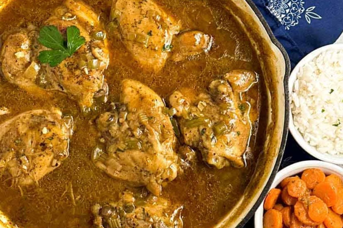 Cajun chicken fricassee in an enameled cast iron skillet.