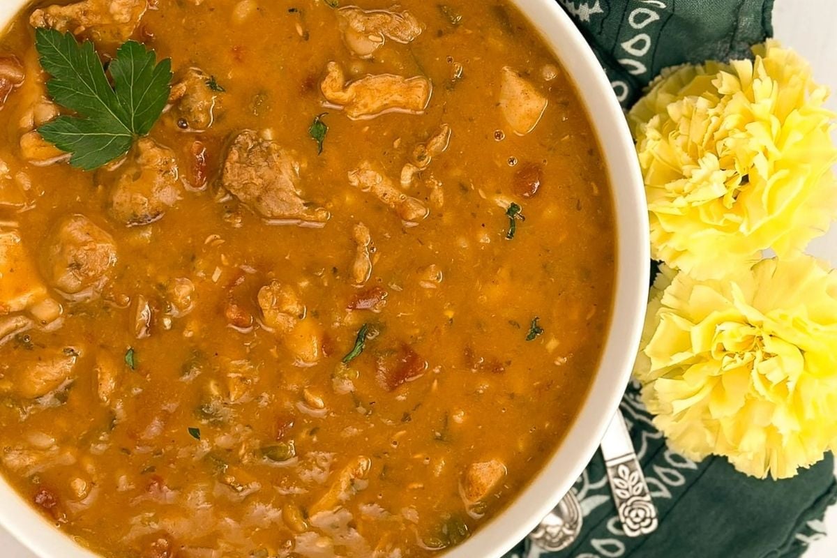 Cajun white chicken chili in a round white bowl.