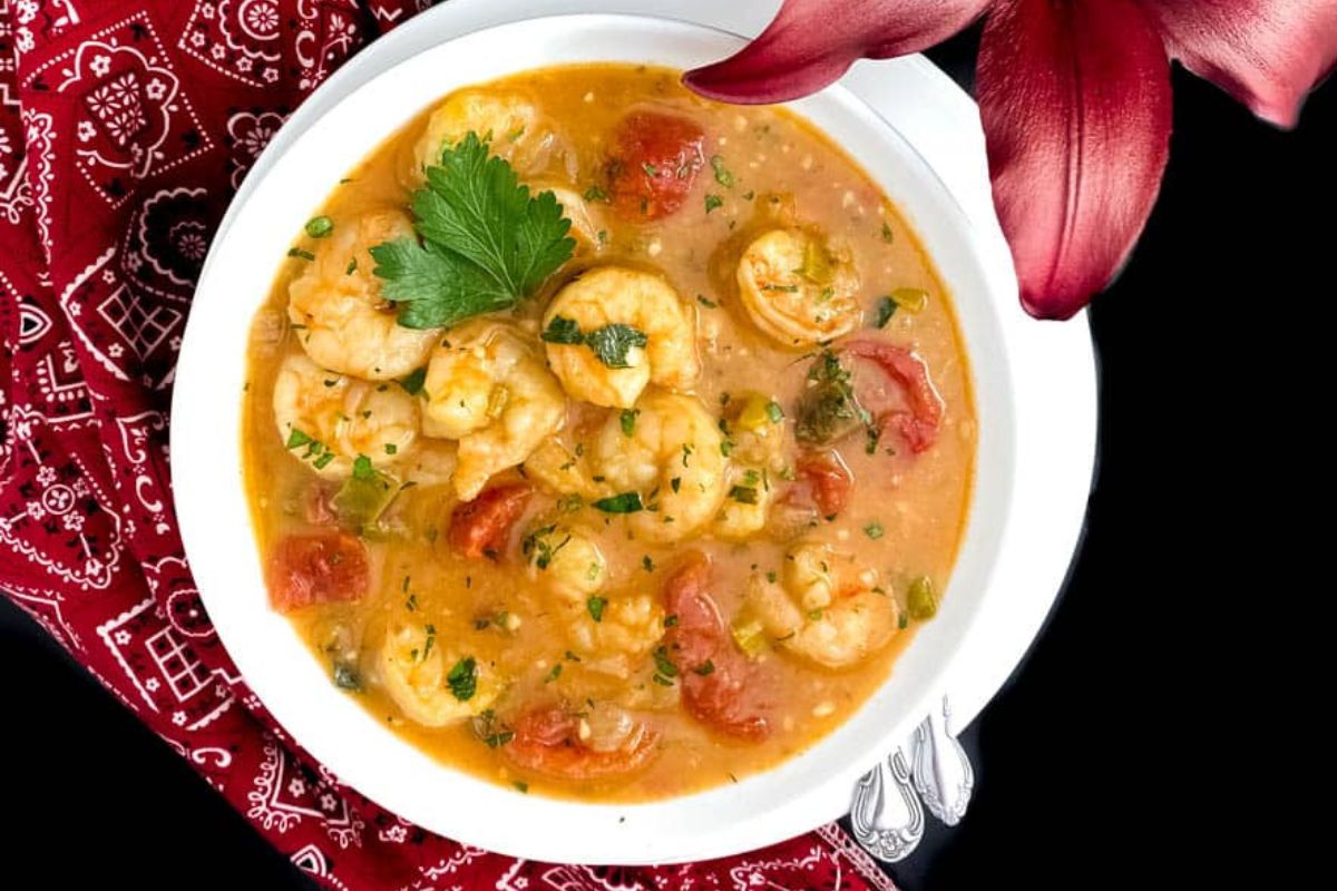 Shrimp etouffee in a round white bowl.
