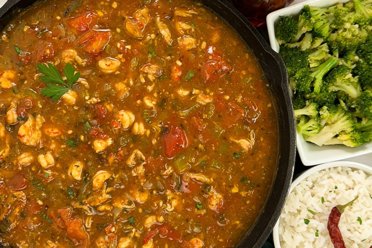 Crawfish etouffee in a black cast iron skillet.
