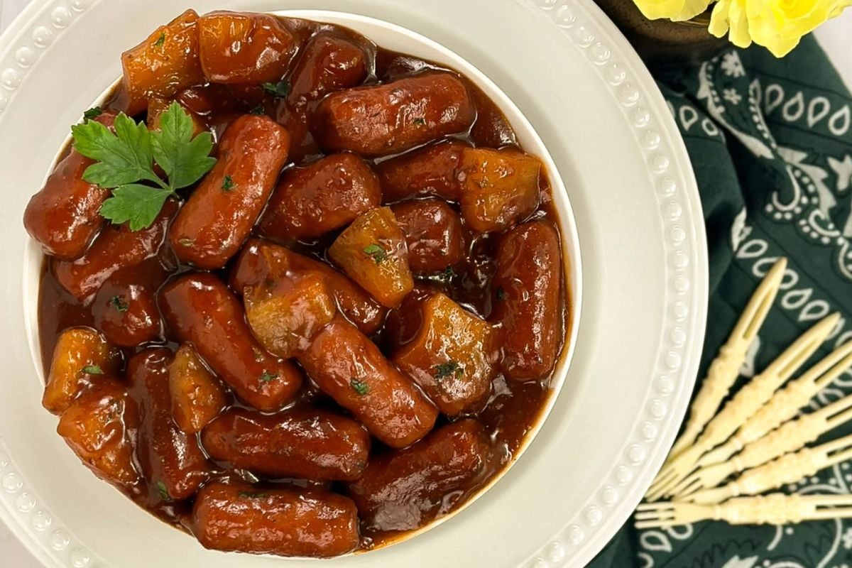 Beef little smokies in a round white bowl.