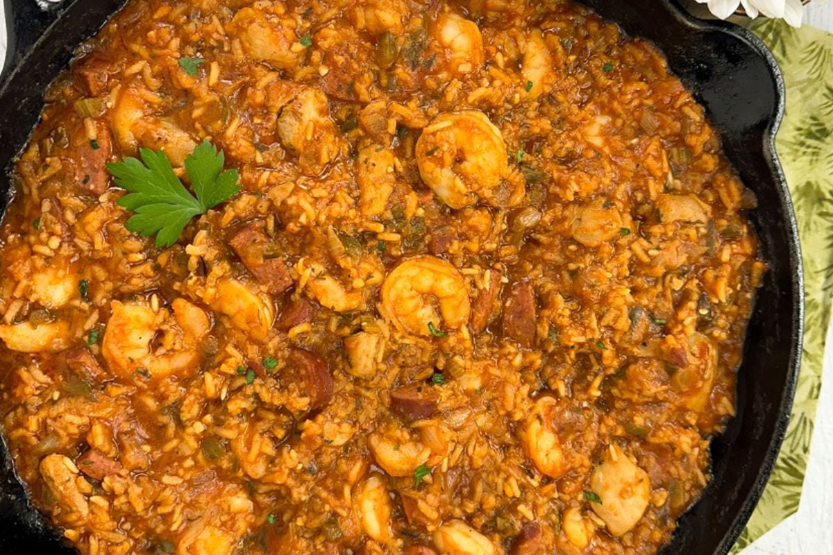 Creole jambalaya in a black cast iron skillet. 