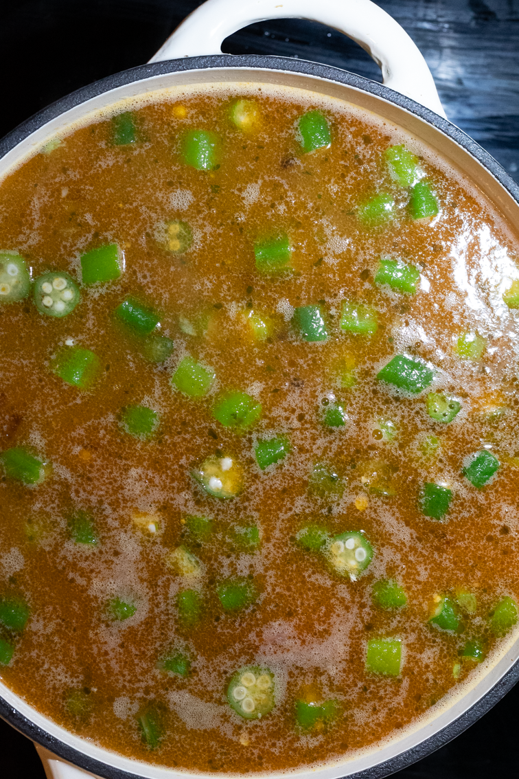 Chicken, sausage, and shrimp gumbo on the stove.