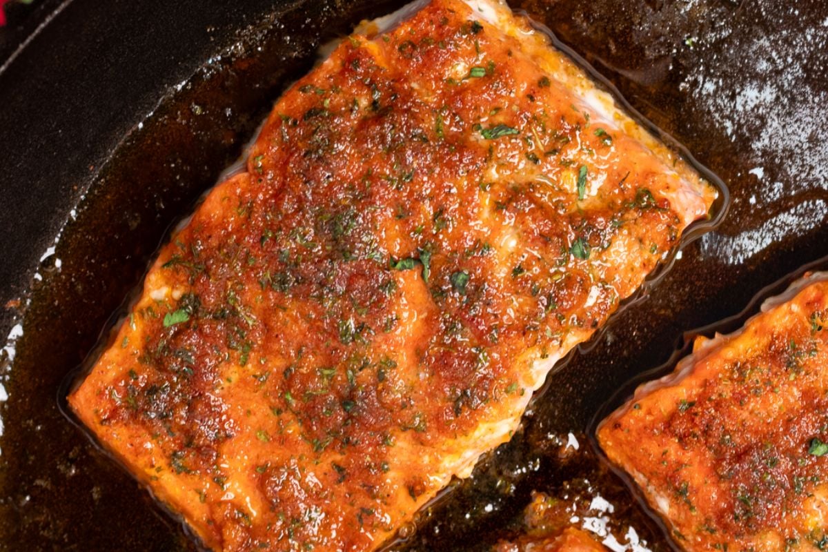 Baked Cajun honey butter fillet in a black pan.