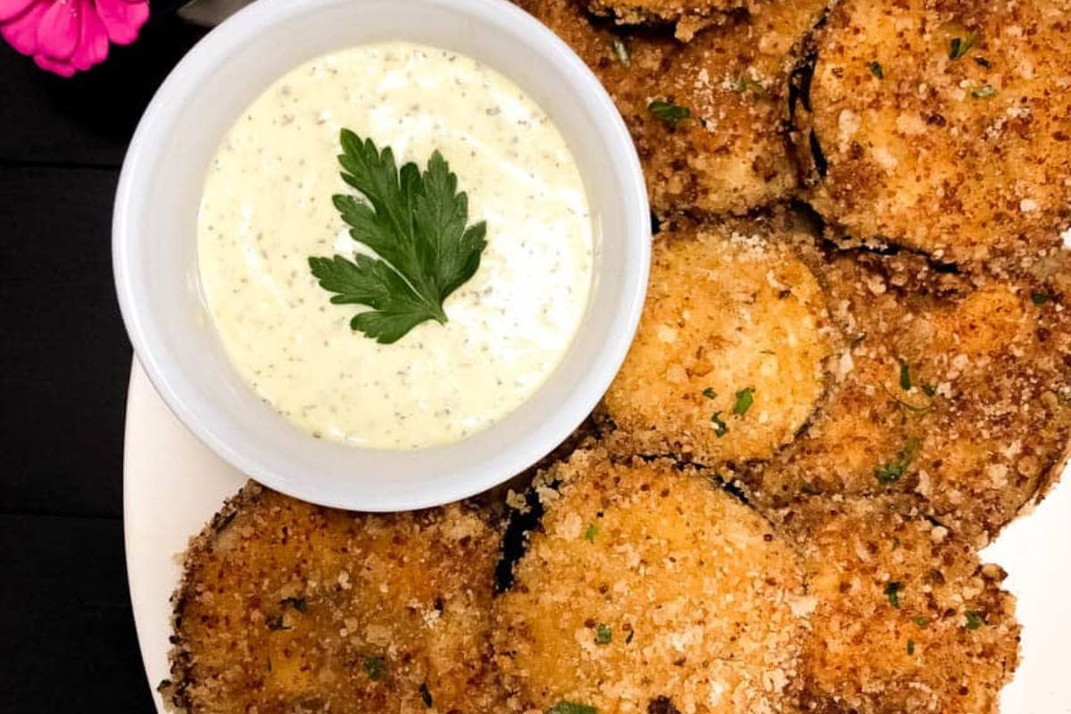 Cajun fried eggplant with a small bowl of Creole basil aioli on the side.