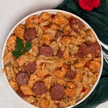 Pastalaya with chicken, sausage, and shrimp in a round white bowl.