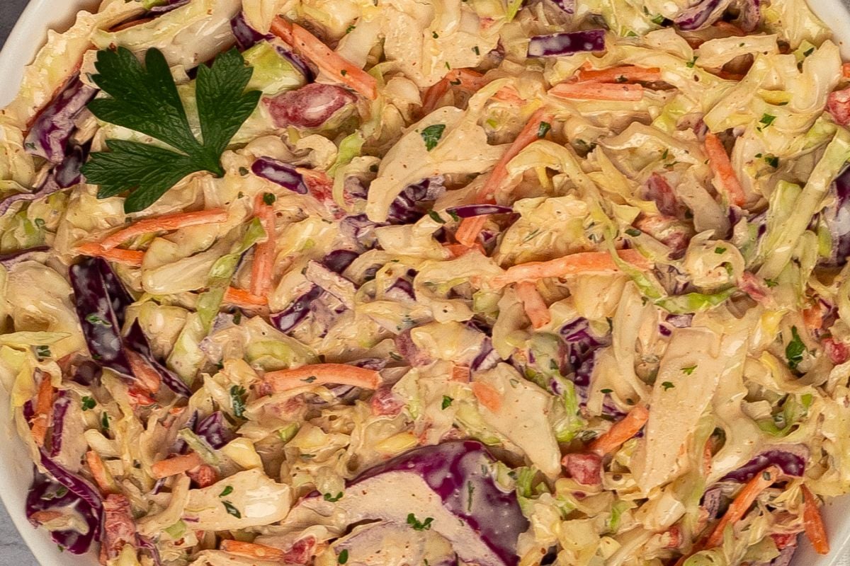 Cajun coleslaw in a round white bowl. 