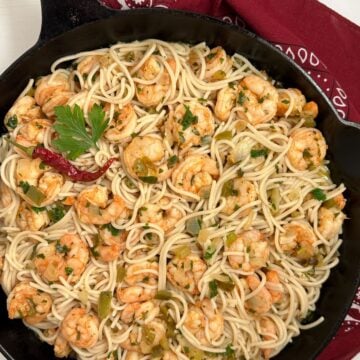 Cajun shrimp scampi in a large cast iron skillet.